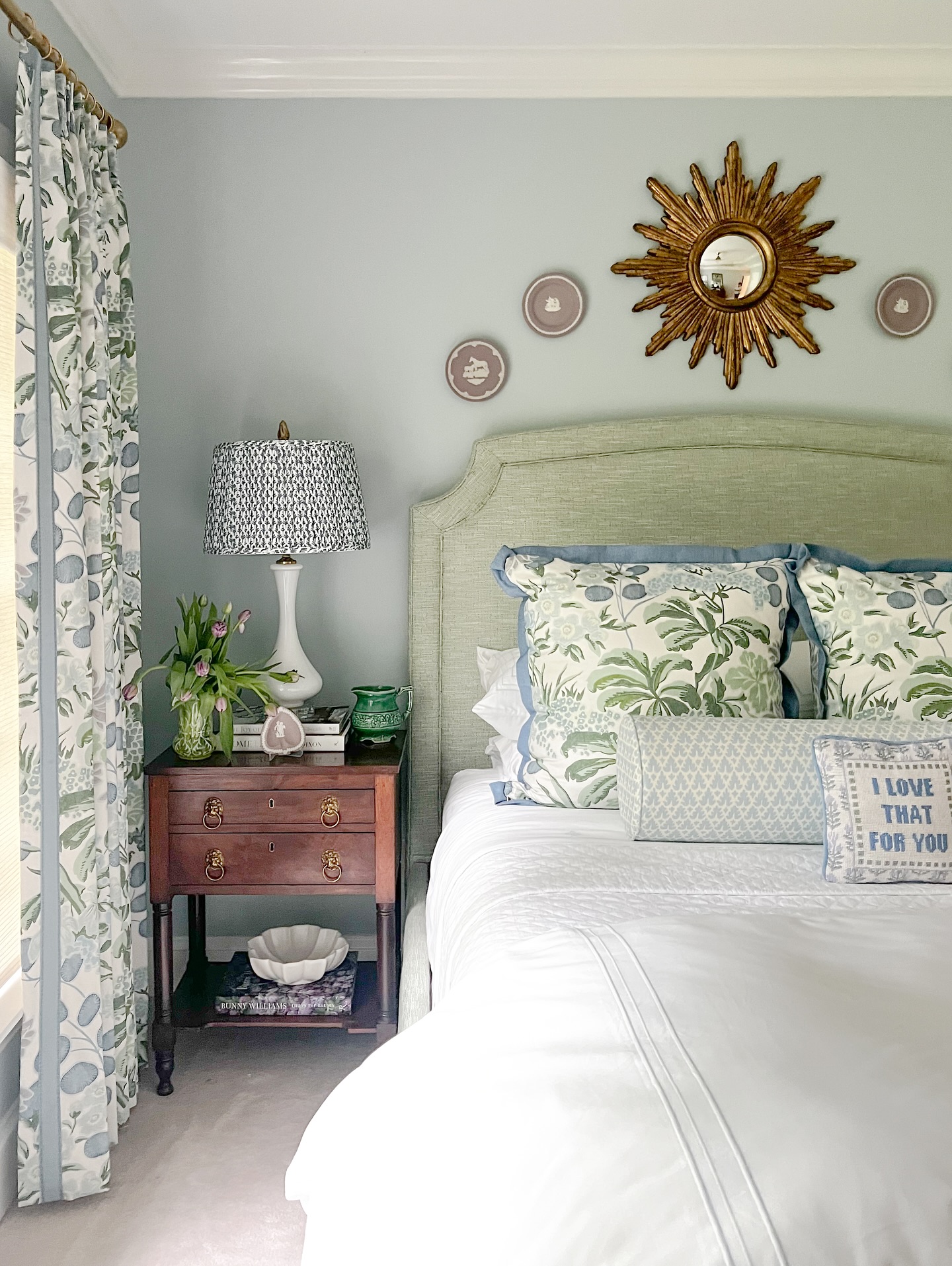 Sunburst Mirror Adds a Glamorous Focal Point Above the Bed