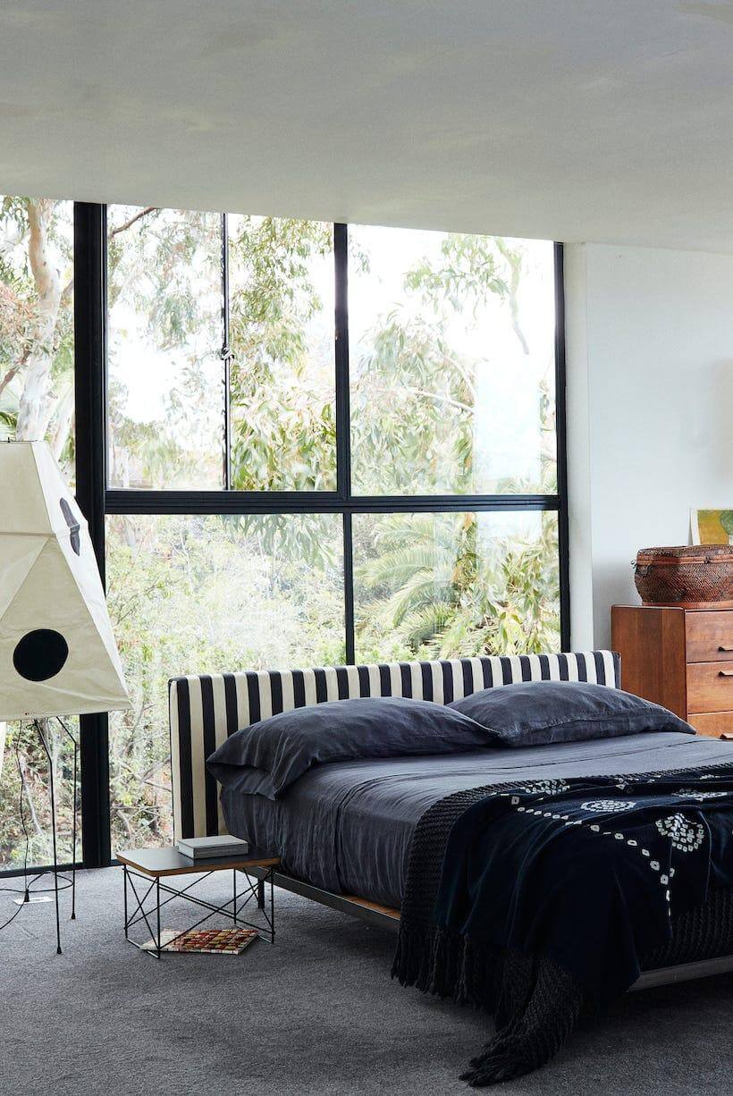 Striped Headboard Creates a Bold Focal Point Behind the Bed