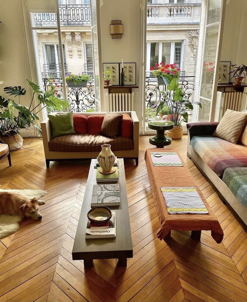 Low, Dark Coffee Table Anchors Seating Area With Stacked Books