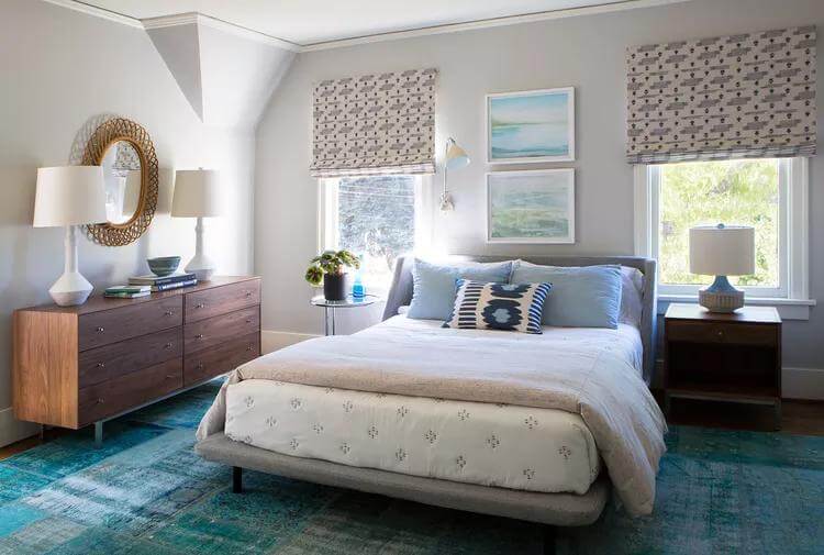 Oval Rattan Mirror Adds Natural Texture Above Dresser