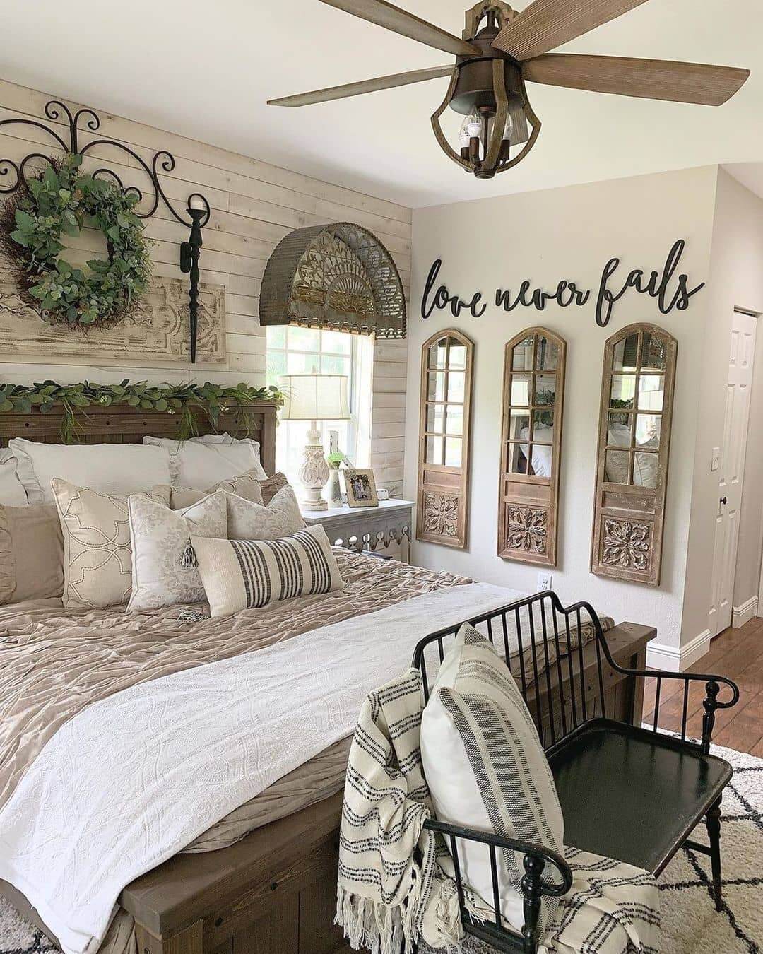 Three Paneled Mirrors Add Rustic Charm Above a Black Bench