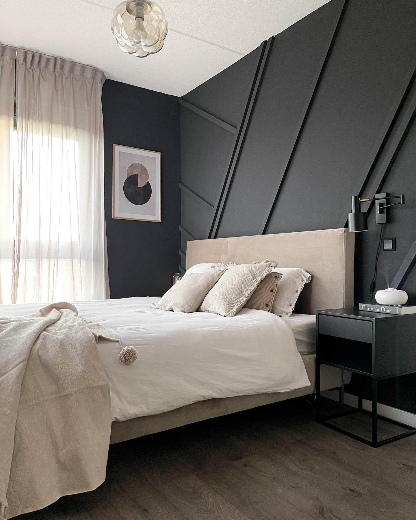 Geometric Black Wall Paneling Adds Dramatic Texture