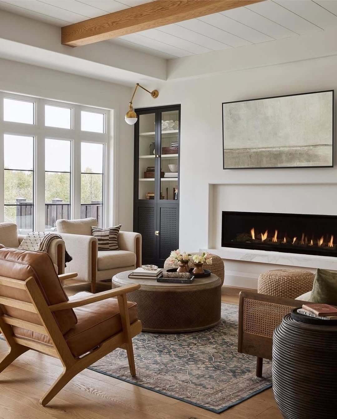 Dark Cabinet Adds Visual Weight Beside the Fireplace