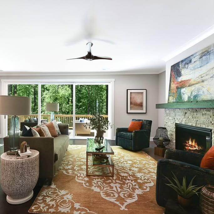 Green Mantelpiece Frames a Textured Stone Fireplace