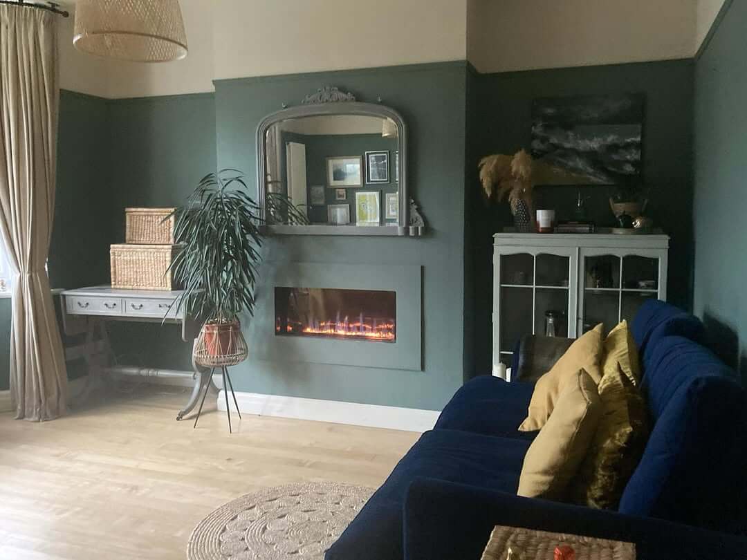 Recessed Electric Fireplace in a Deep Green Wall