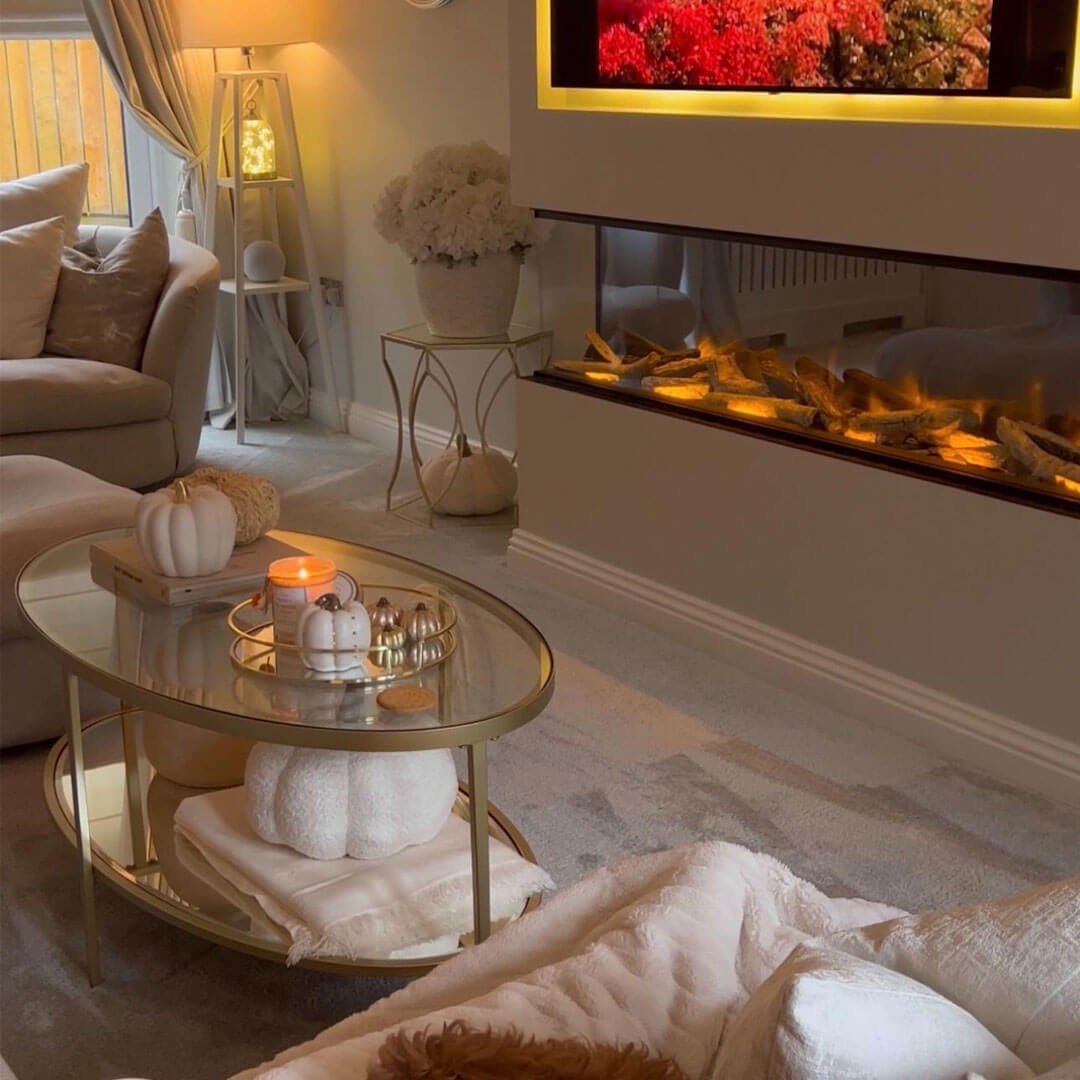 Glass Coffee Table Holds Seasonal Decor and a Warm Candle