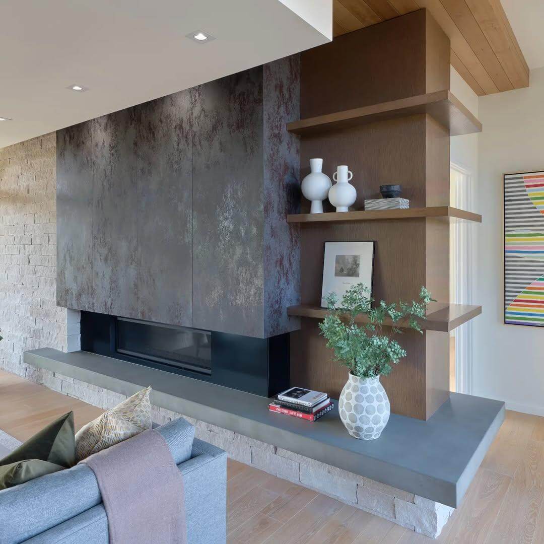 Floating Wood Shelves Complement the Concrete Hearth