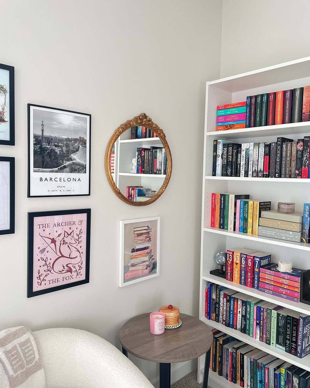 Ornate Gold Mirror Reflecting Bookshelf Contents
