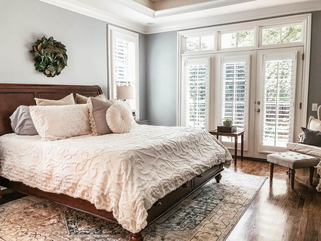 Greenery Wreath Adds Natural Texture Above the Bed