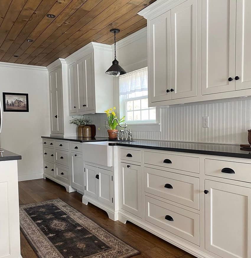 Warm Wood Plank Ceiling Adds Rustic Texture Above White Cabinets
