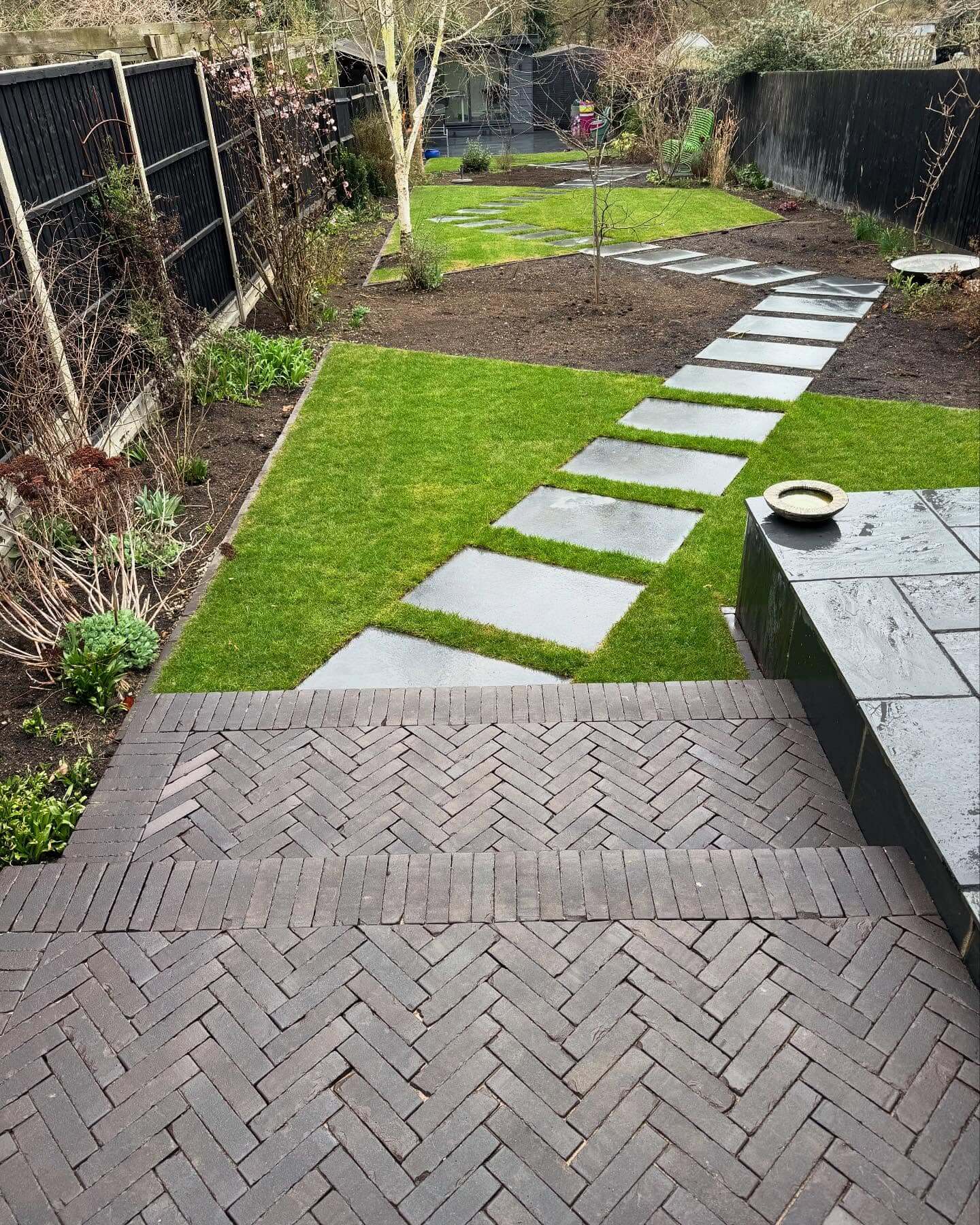 Dark Herringbone Brick Steps Create a Dramatic Entrance