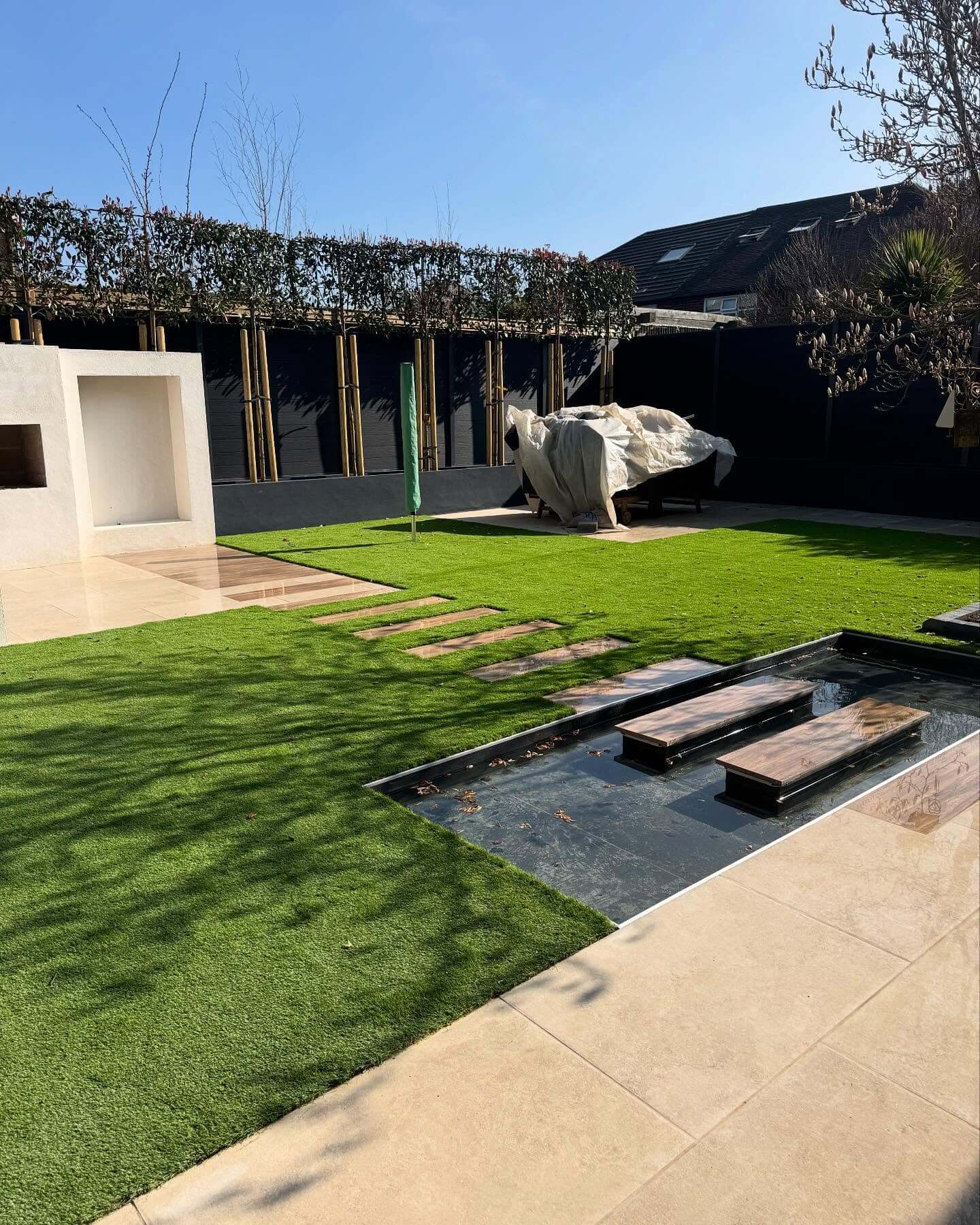 Wooden Plank Stepping Stones Across a Reflecting Pool