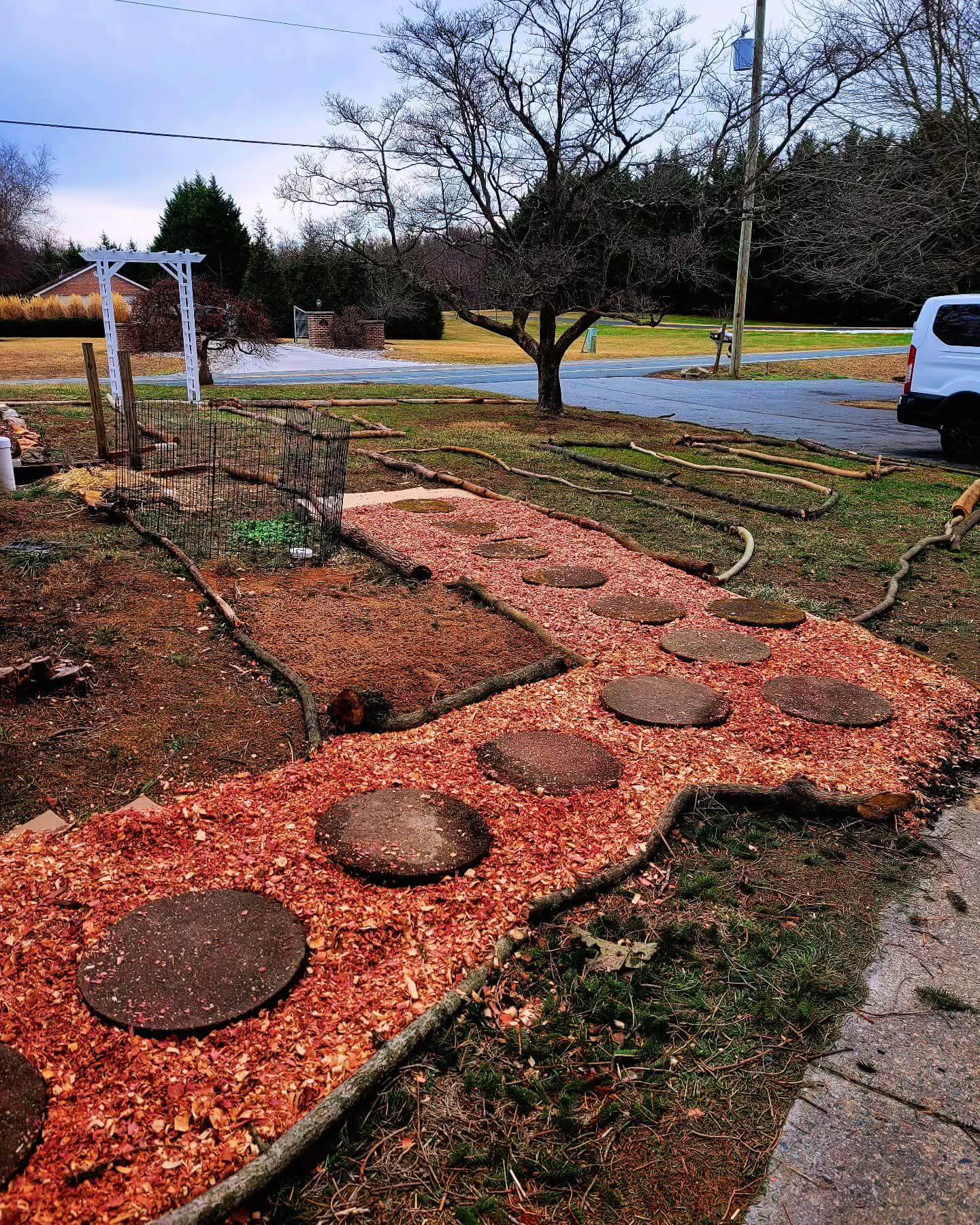 Frame a Bark-Mulched Path with Natural Branch Borders