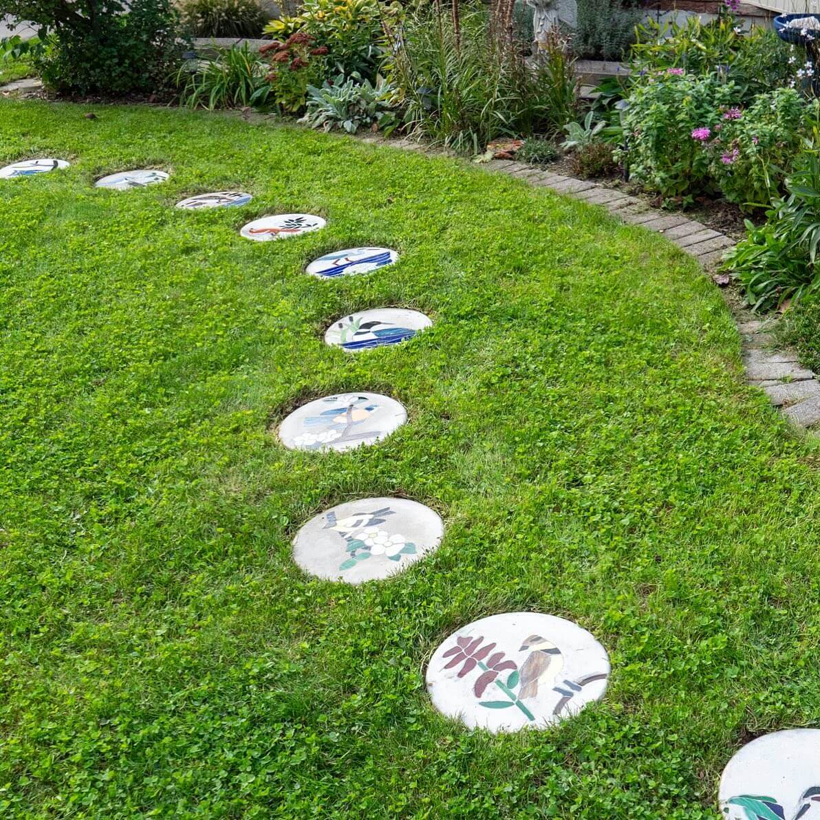 Journey Through Your Garden with Circular Stepping Stones Featuring Detailed Mosaics