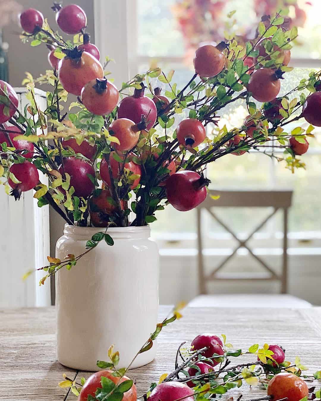 Pomegranate Branches in a Simple Cream Jar