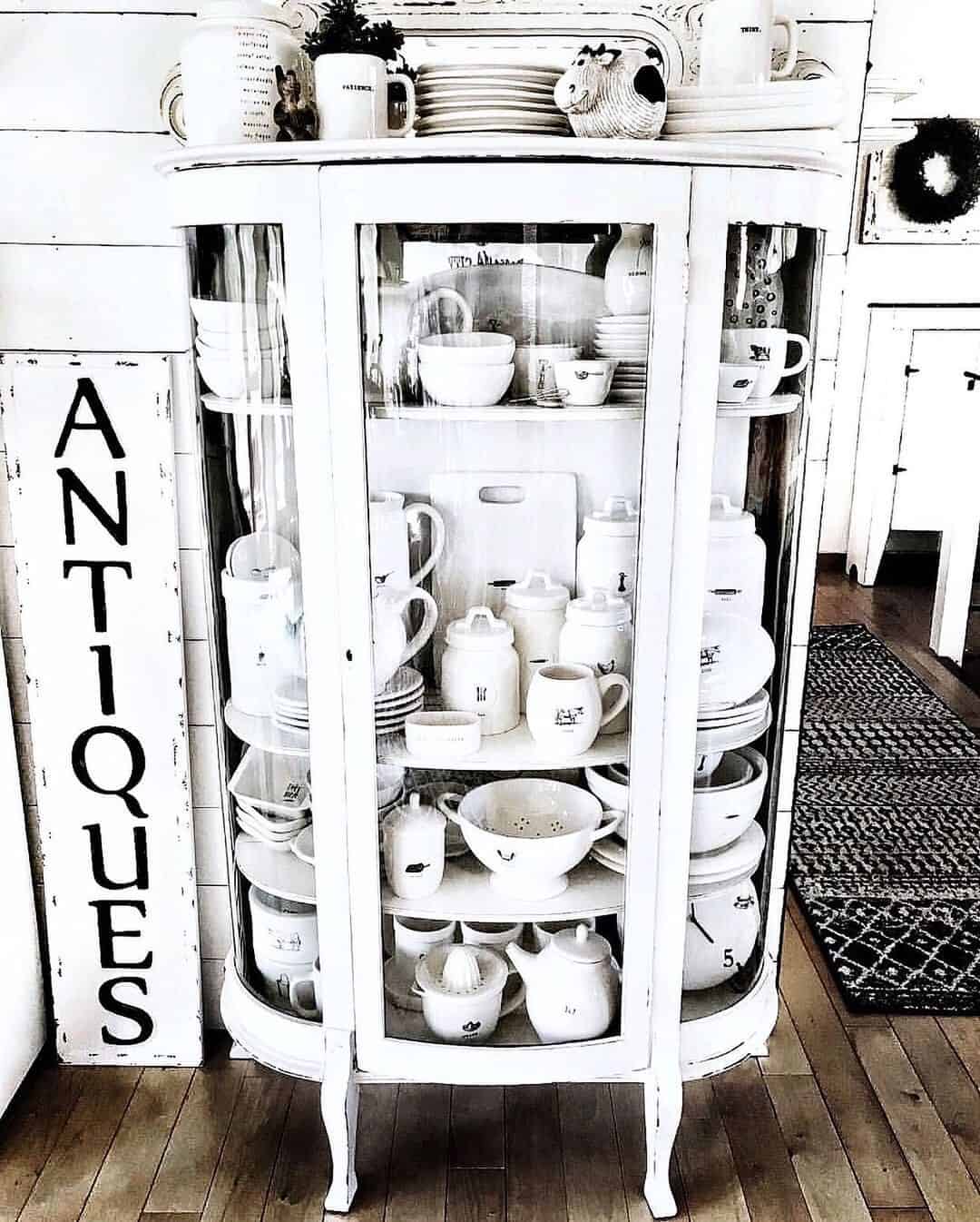 Tiered Kitchenware Display in a Glass-Door Cabinet