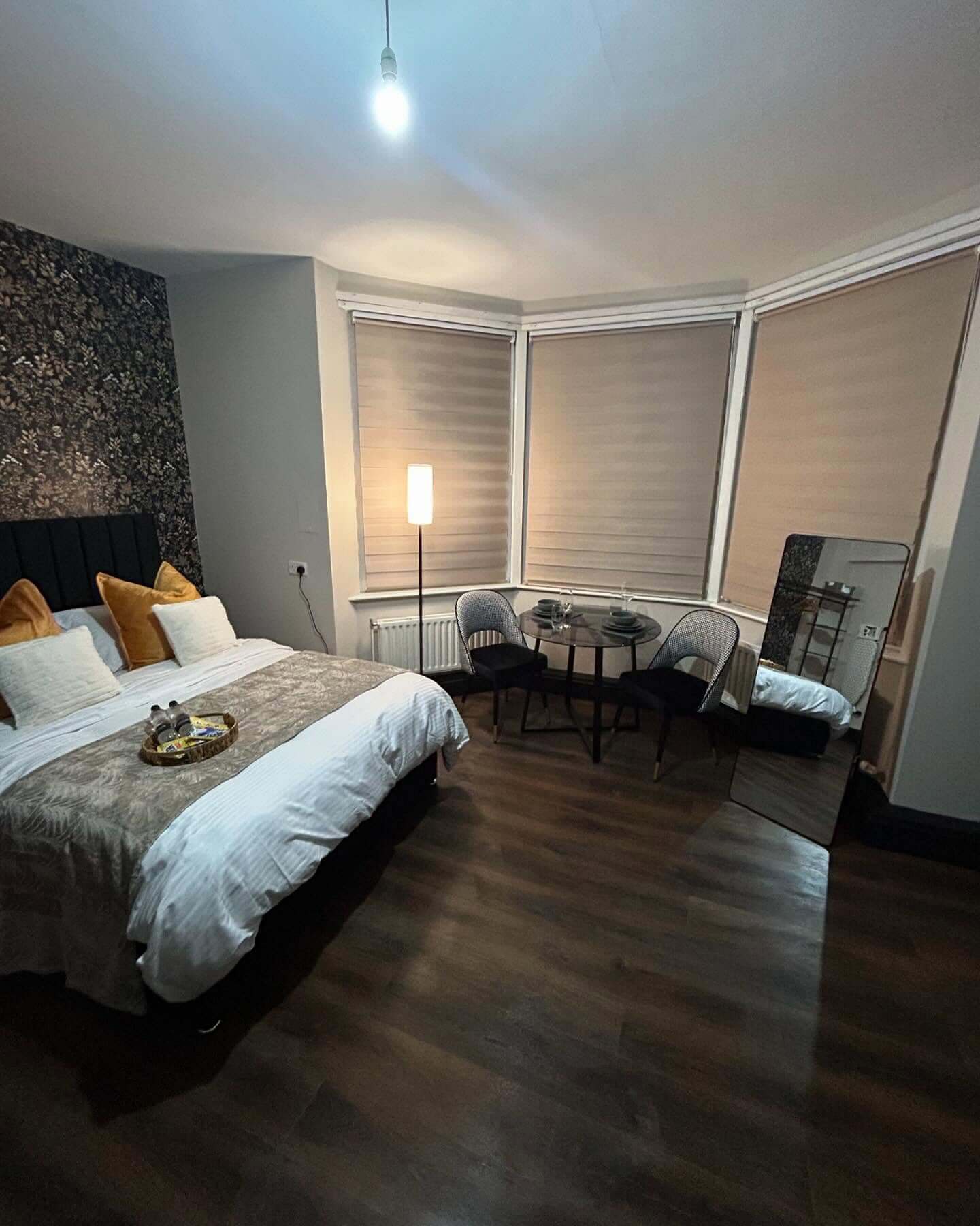 Textured Wallpaper Adds a Dramatic Backdrop to the Bed