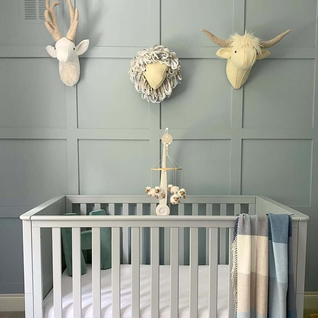 Plush Animal Heads Add Whimsical Charm Above the Crib