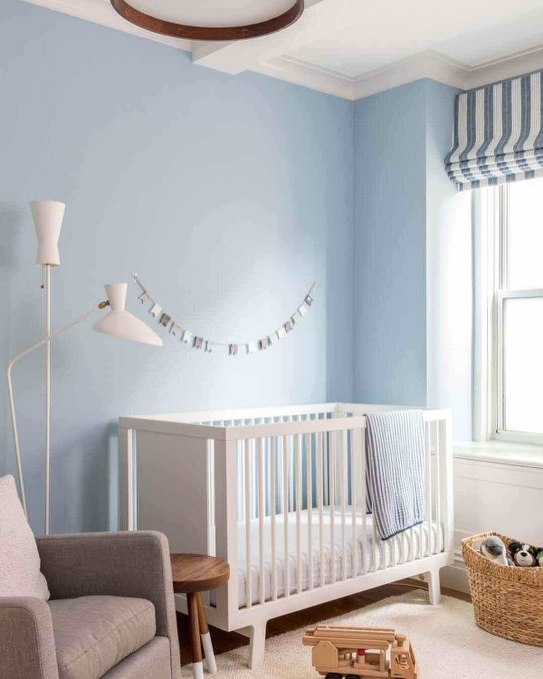 Delicate Photo Garland Adds a Personal Touch Above the Crib
