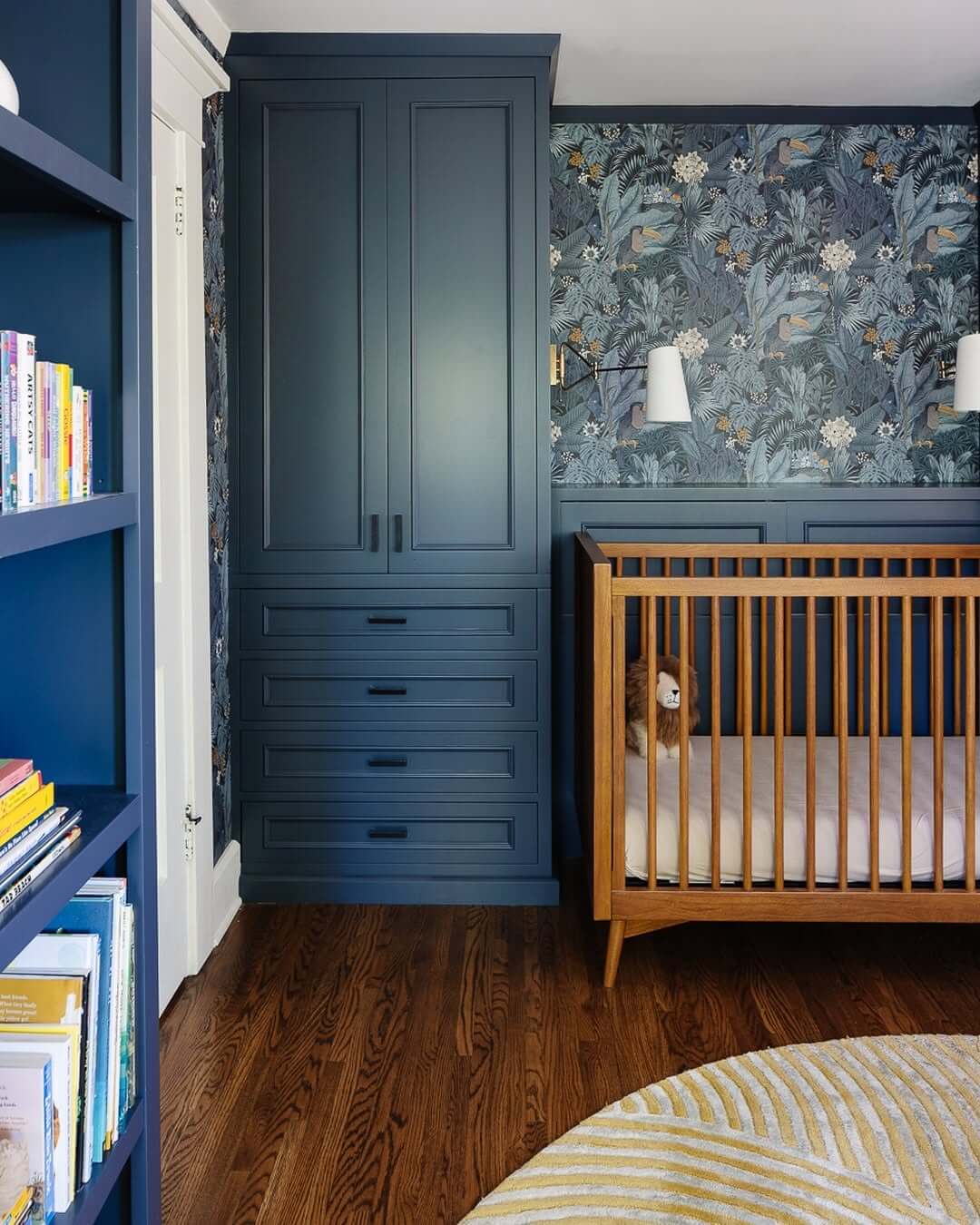 Frame a Tropical Nursery Wall with Built-in Blue Cabinetry