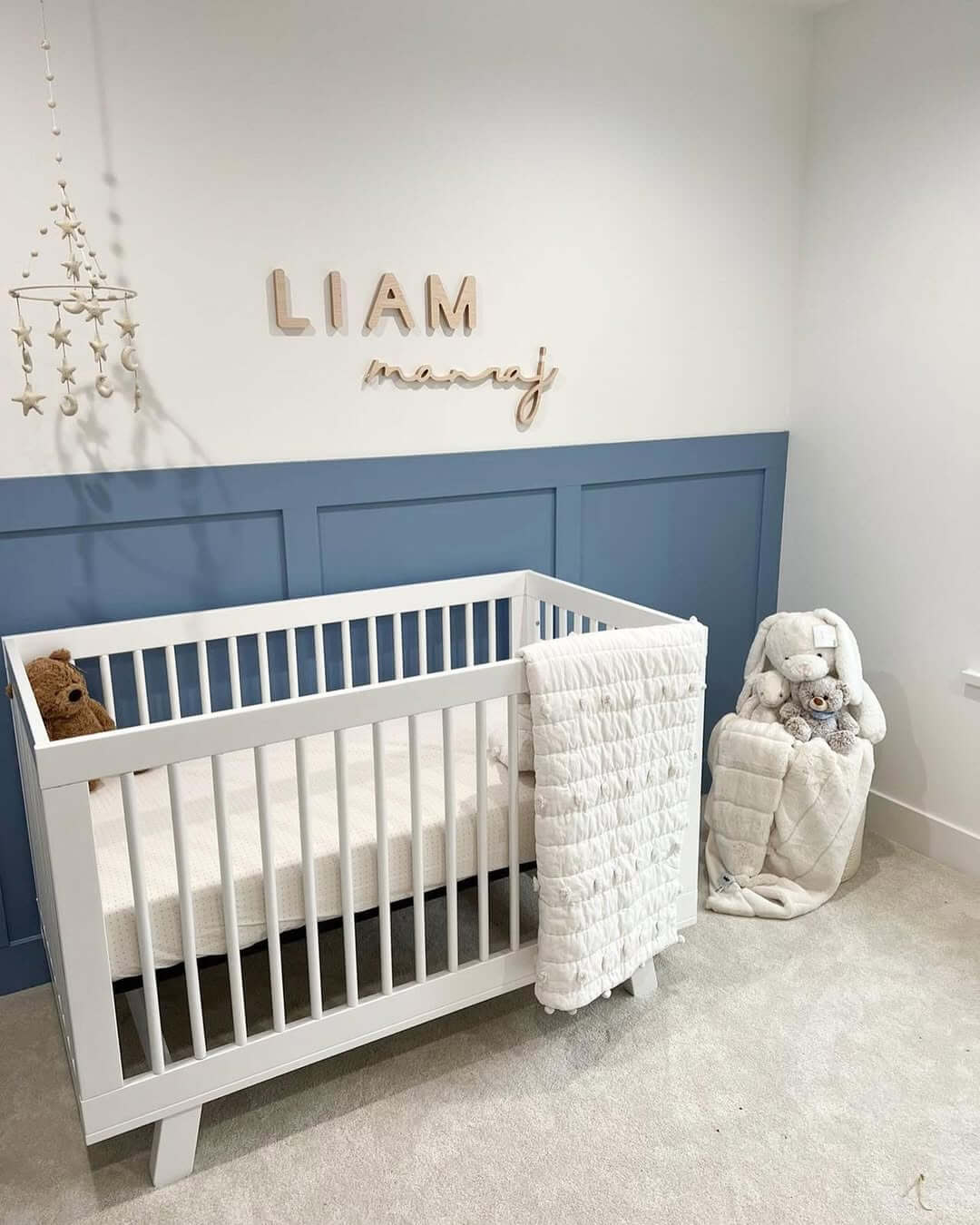 Wooden Name Cutouts Add a Personal Touch Above Blue Wainscoting
