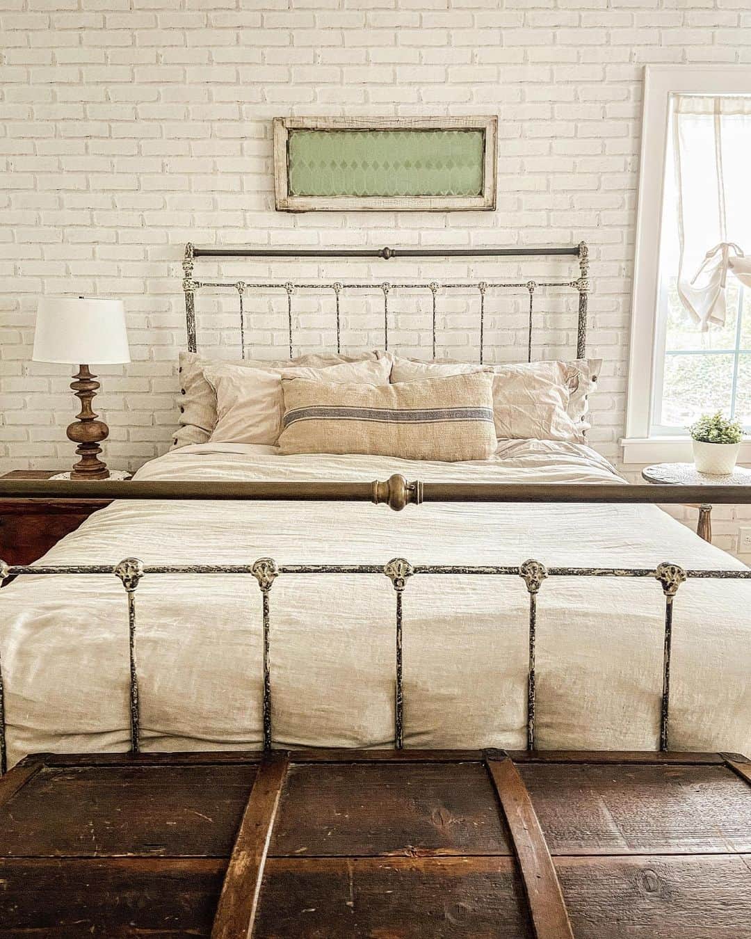 Vintage Window Frame Adds Textured Art Above Bed