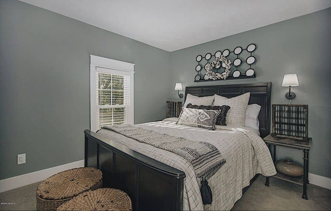 Round Mirror Grid Art Adds Depth Above the Bed