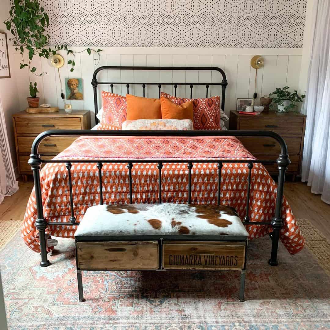 Anchor Your Bed with a Metal Frame and Patterned Quilt