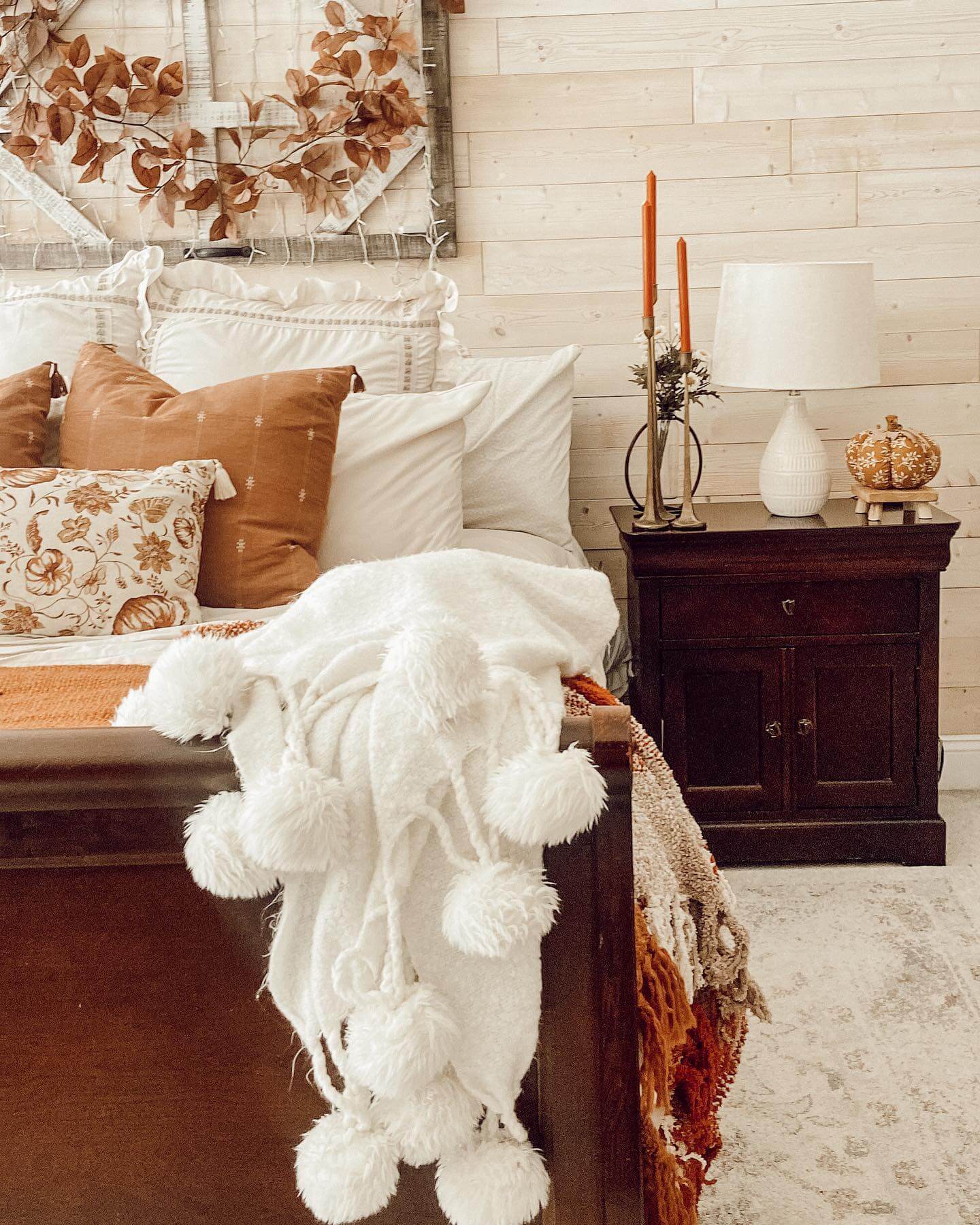 White Pom-Pom Throw Adds Cozy Texture To The Bed