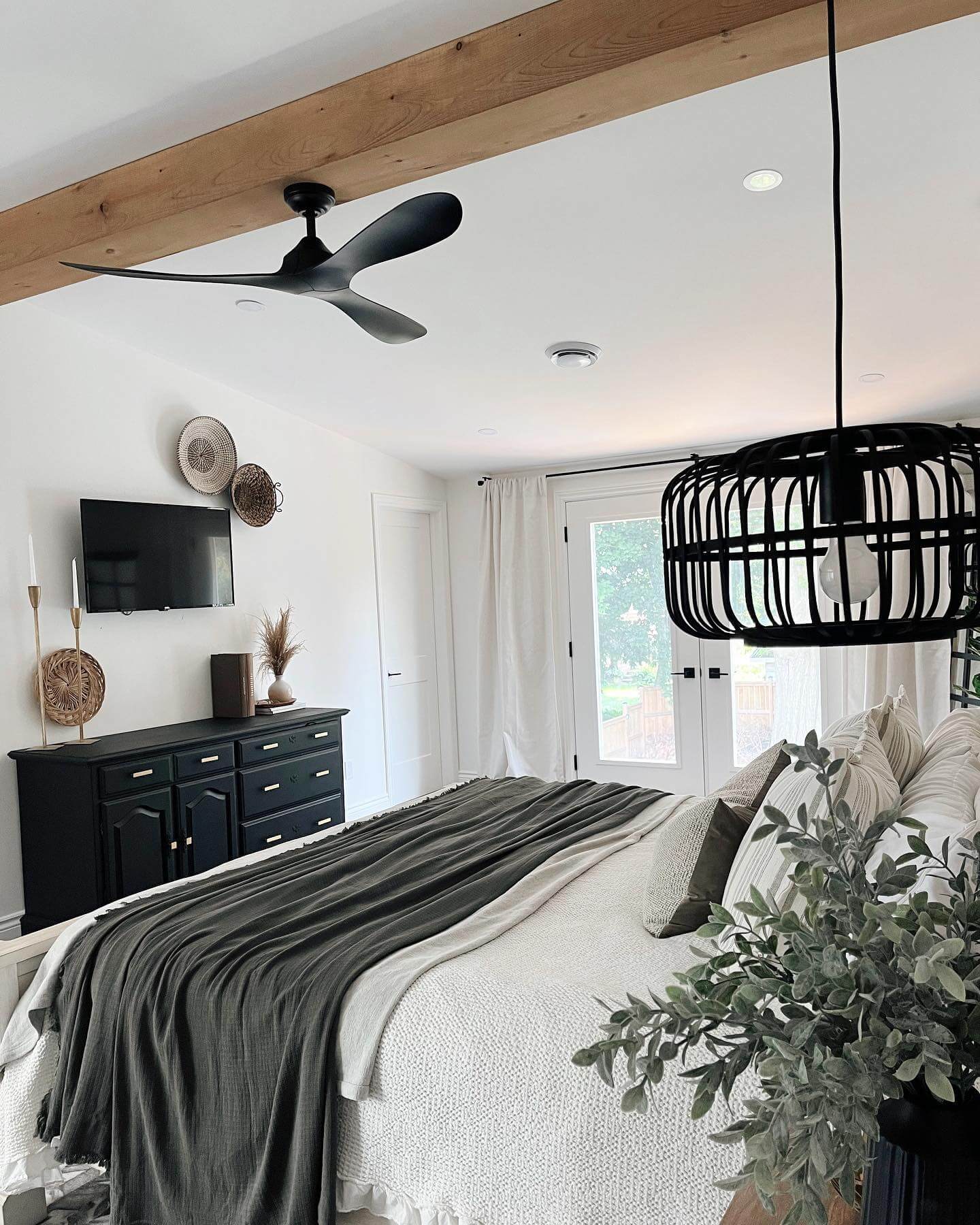 Black Pendant Light Creates a Dramatic Focal Point