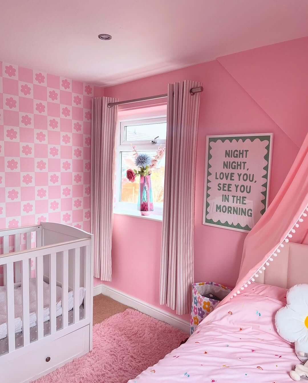 Playful Pink Checkerboard Wallpaper with Floral Accents