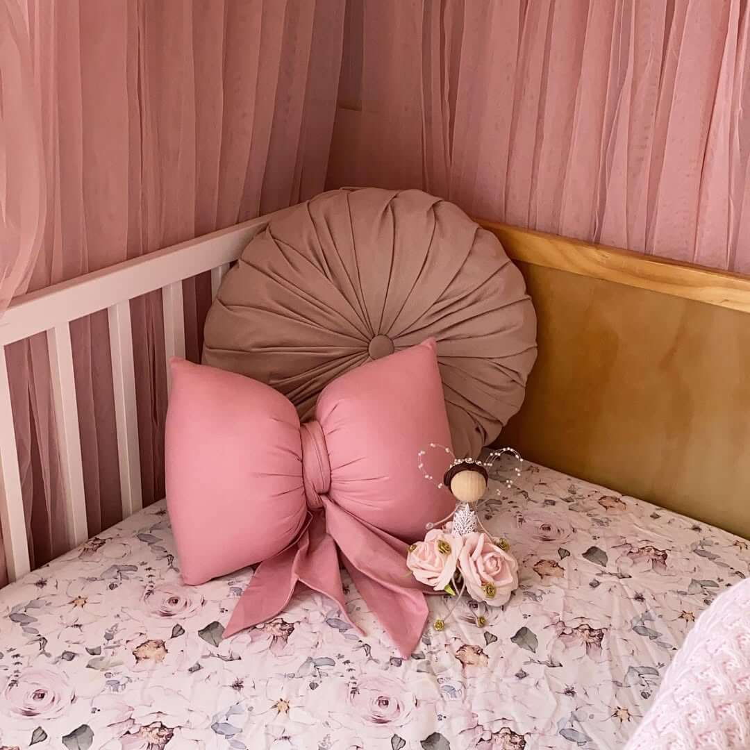 Oversized Bow Pillow Adds Whimsical Softness to the Crib