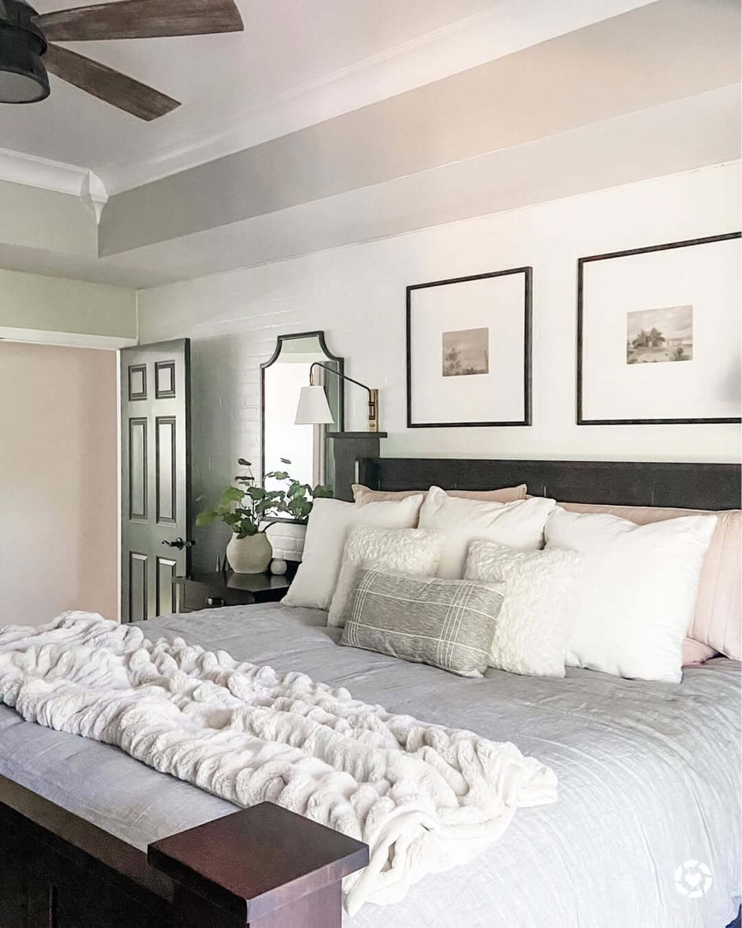 Framed Landscape Art Creates Symmetry Above the Bed