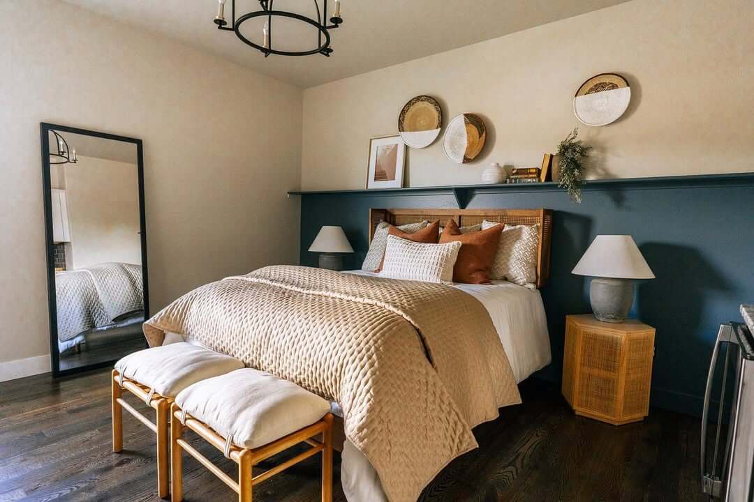 Dark Teal Wall Creates a Bold Backdrop with Layered Decor