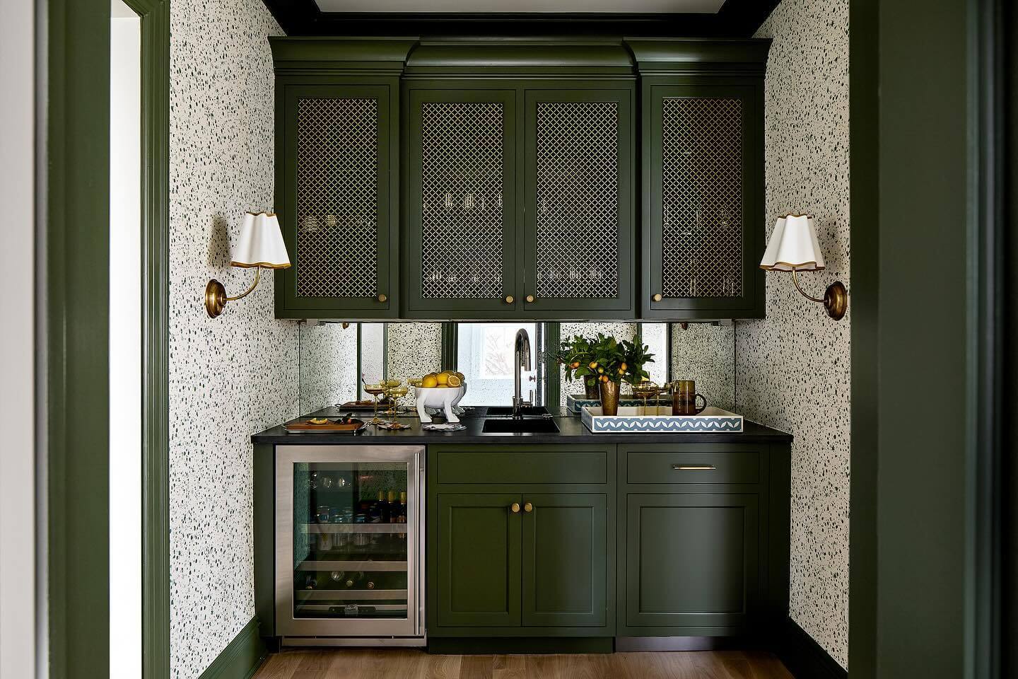 Conceal Items with Dark Green Cabinetry and Lattice Doors