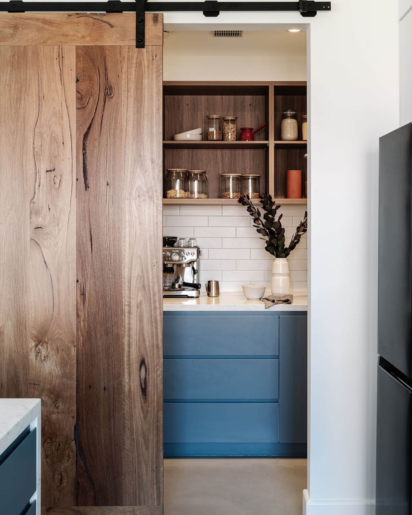 Hide Clutter with a Rustic Barn Door