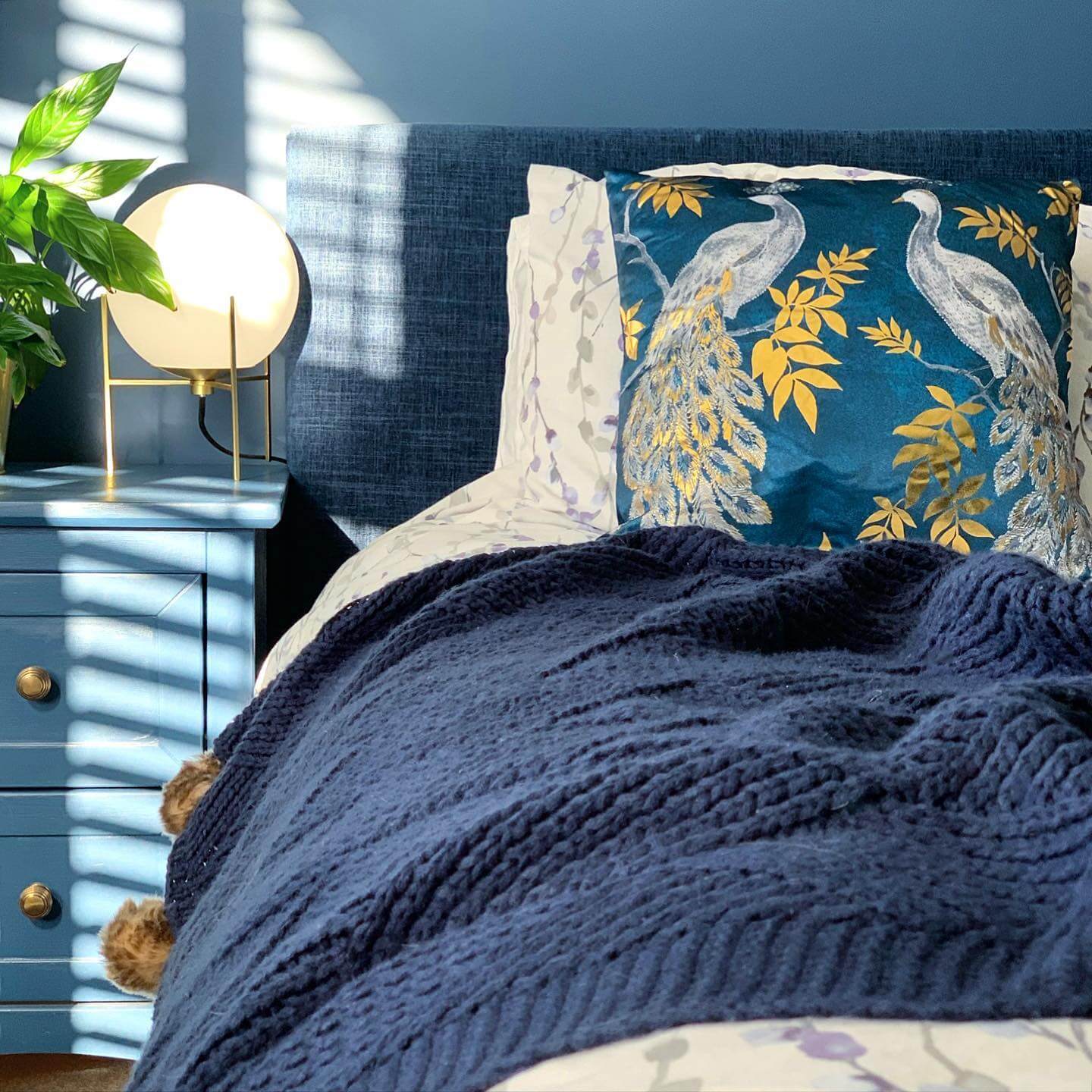 Peacock Pillow Adds Rich Pattern to Navy Bedding