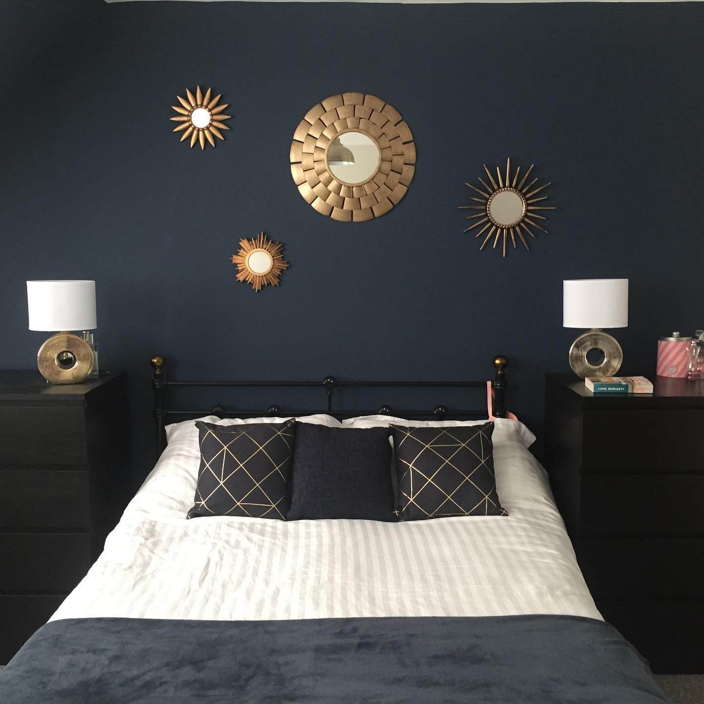 Gold Sunburst Mirrors Add Glamour Above Navy Walls
