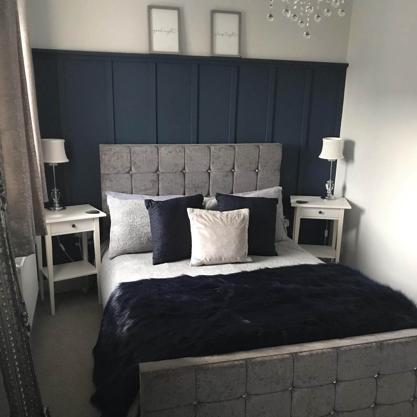 Paneled Navy Wall Creates a Dramatic Headboard Backdrop