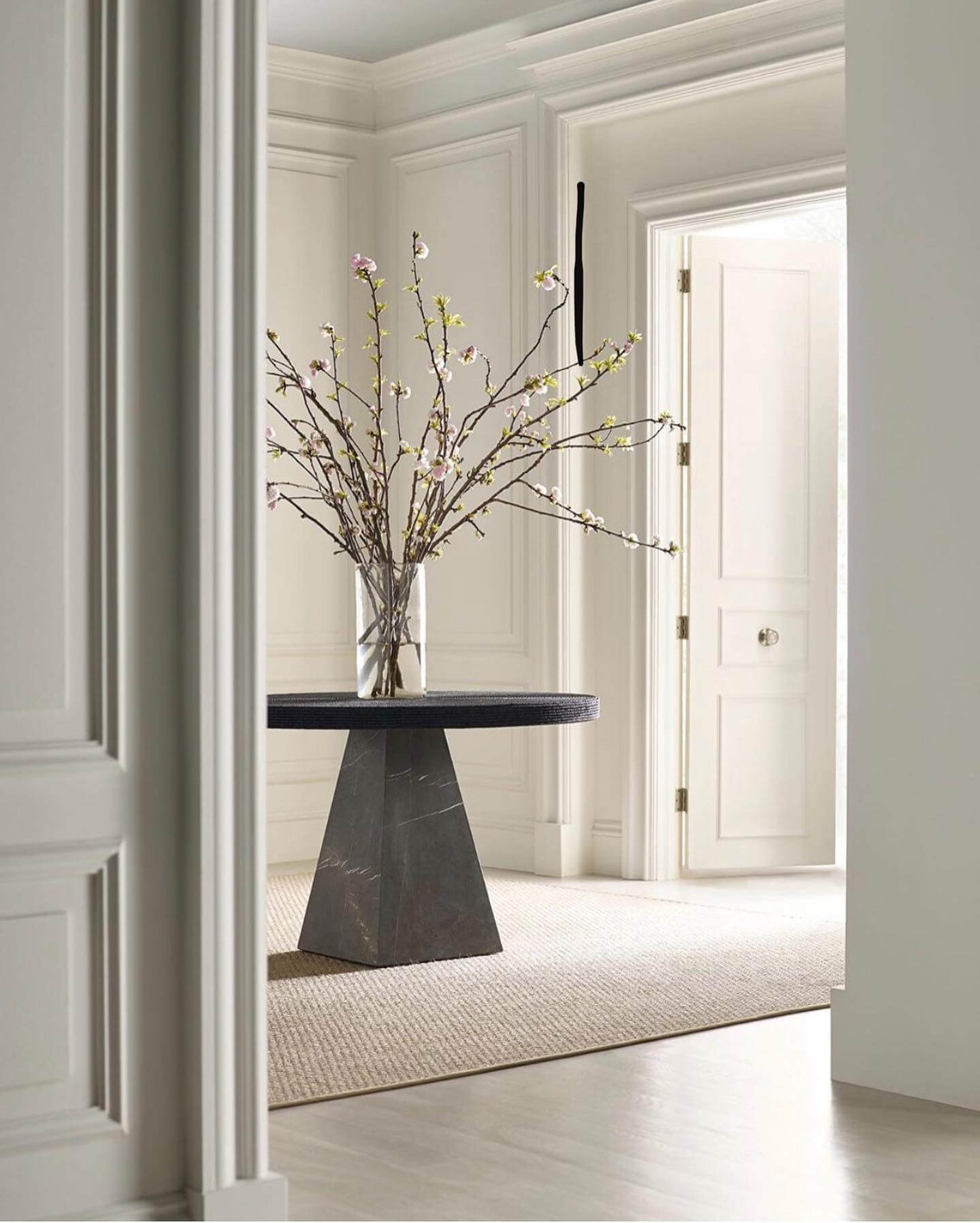 Sculptural Pedestal Grounds Entryway with Natural Touches