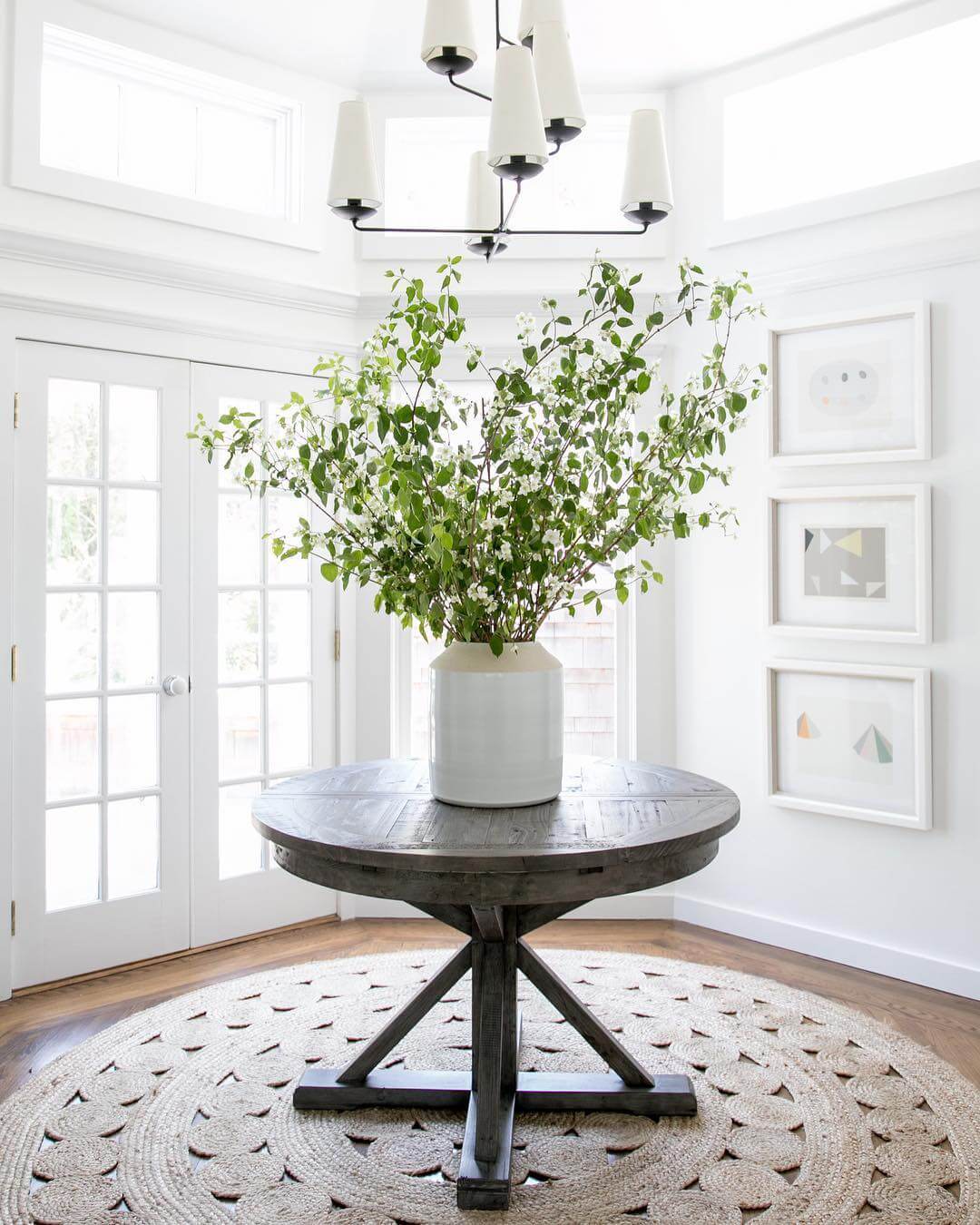 Dark Wood Table with Generous Greenery Arrangement