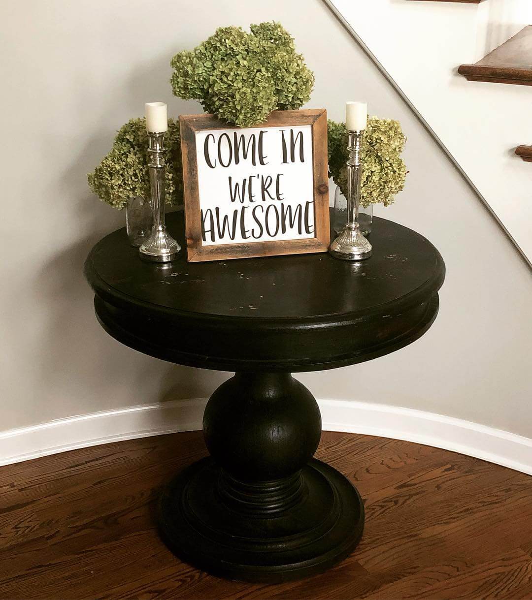 Turned Pedestal Table Welcomes Guests with Greenery