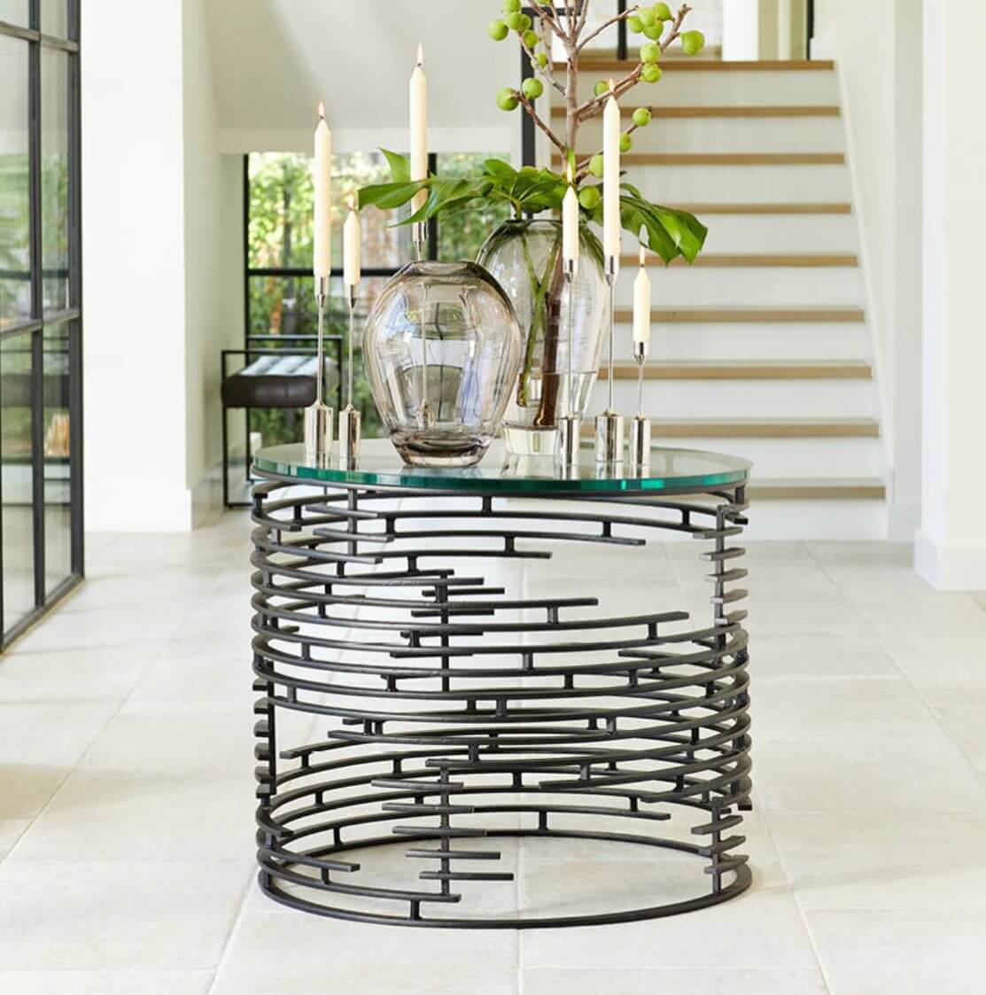 Glass-Top Table with Abstract Metal Base