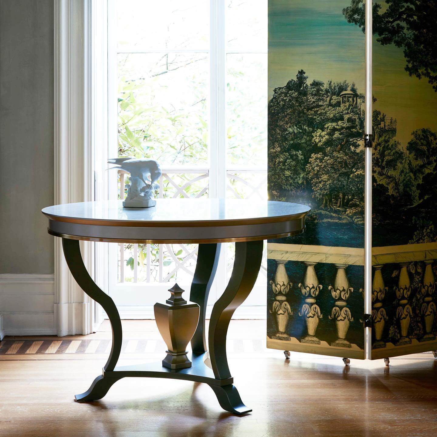 Round Table with Ceramic Bird and Metallic Urn