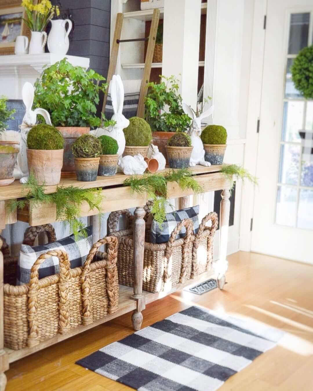 White Bunny Statues Pair With Mossy Spheres on a Console