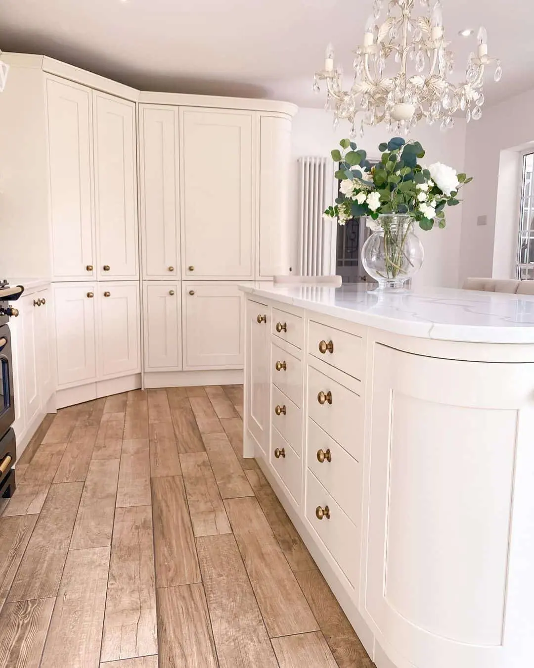 Cream Cabinetry with Brass Hardware for a Welcoming Kitchen