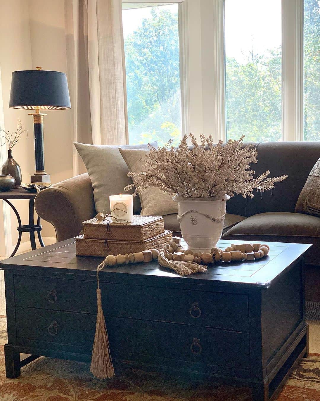 Woven Boxes and Beads Layered on a Dark Coffee Table
