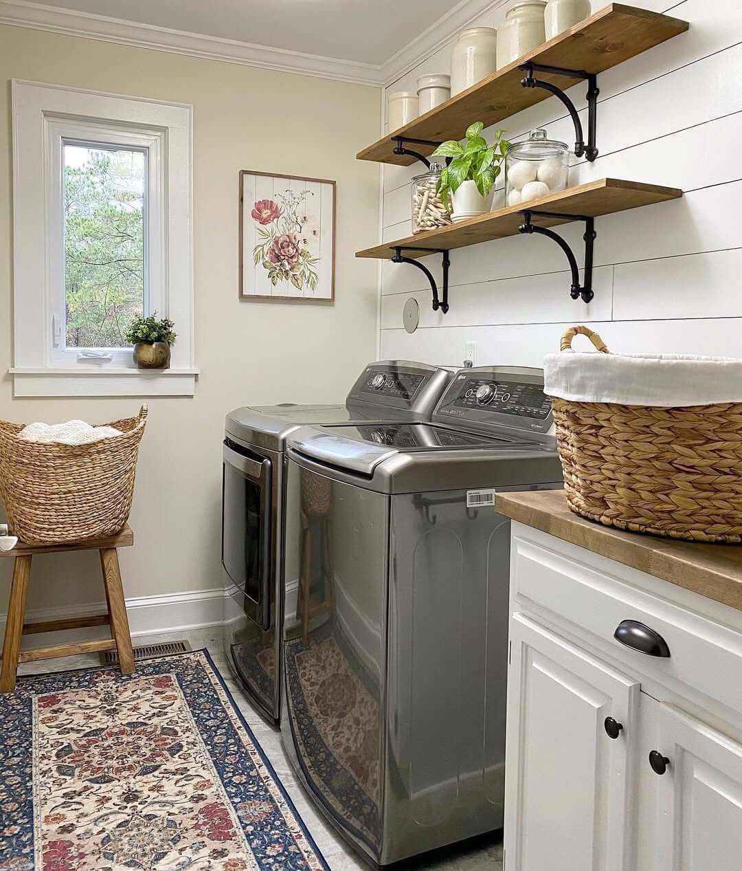Wooden stool holds a woven basket of linens