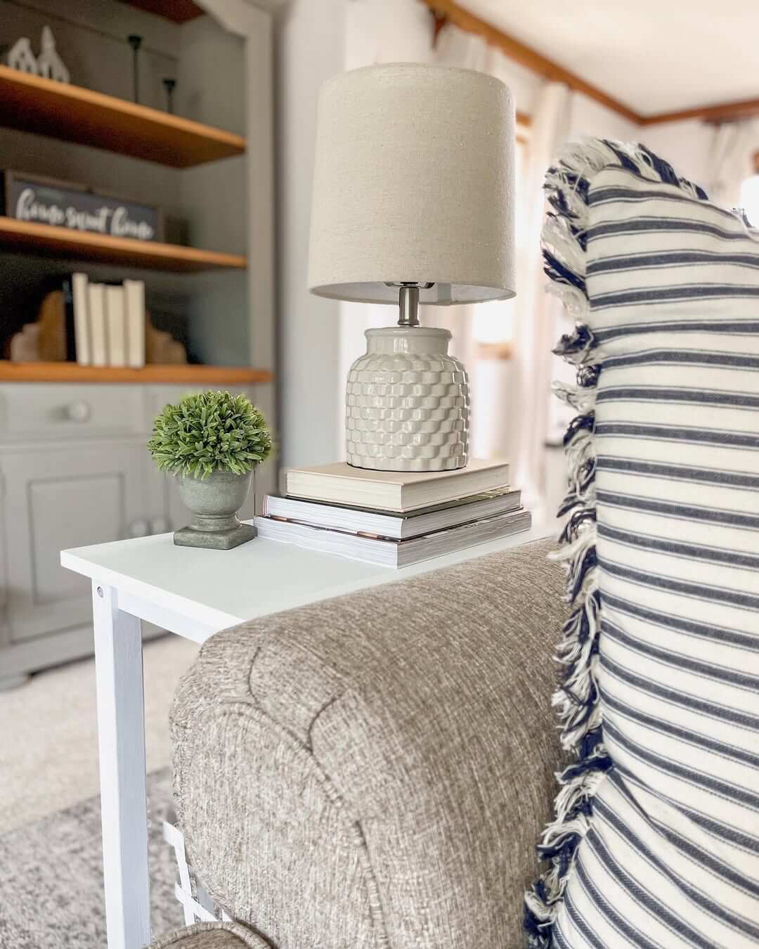 Stack Books To Create A Layered Base For A Table Lamp