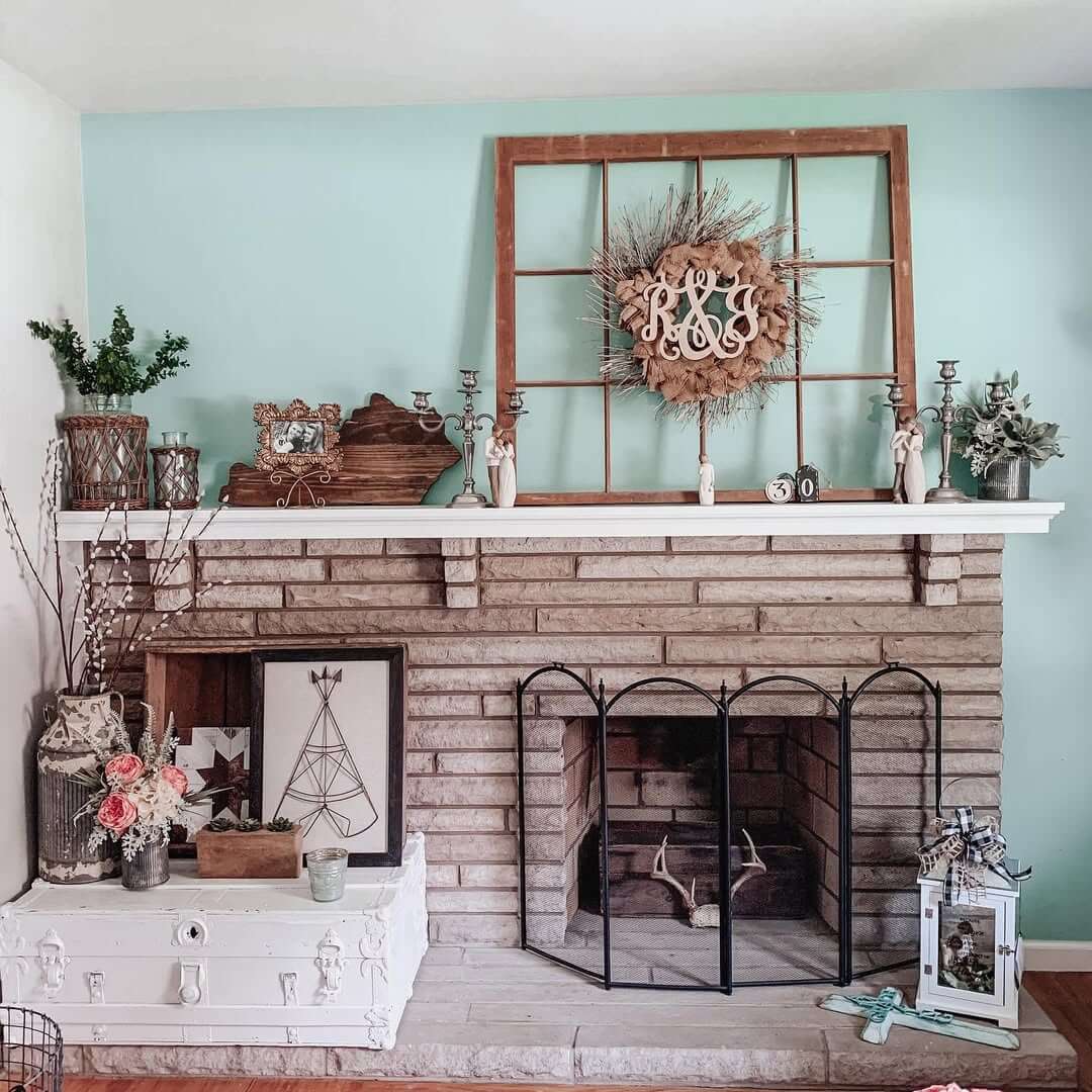 Rustic Window Frame Creates A Layered Mantel Display